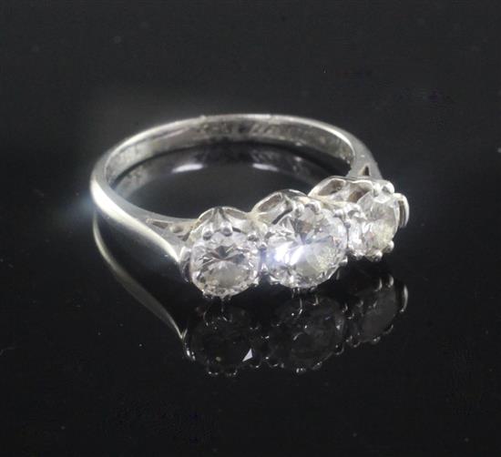 A 1940s platinum and three stone diamond ring, size J.